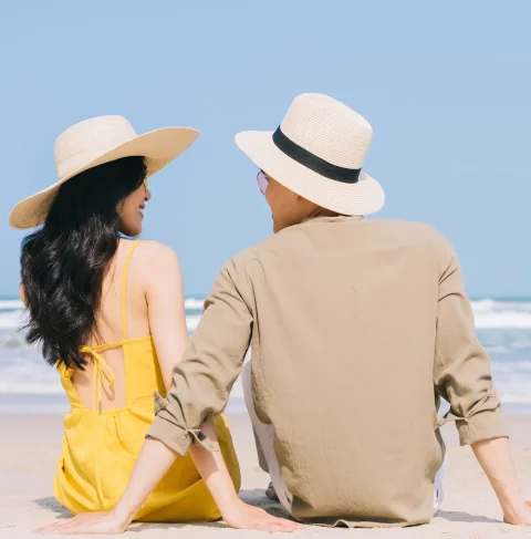 young-asian-couple-enjoying-summer-vacation-beach
